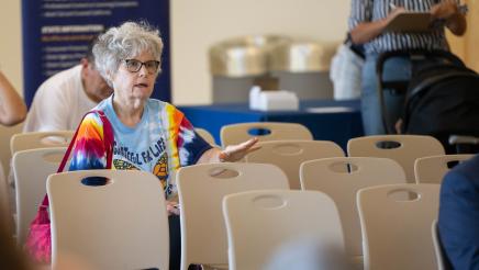 Audience member listening to the speaker