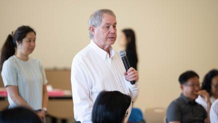 Attendee speaking at the event