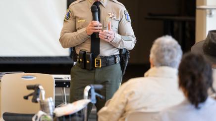 Local police officer speaking at the event