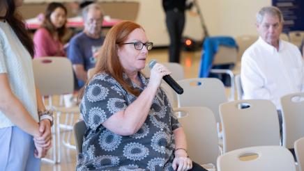 Audience member speaking at the event