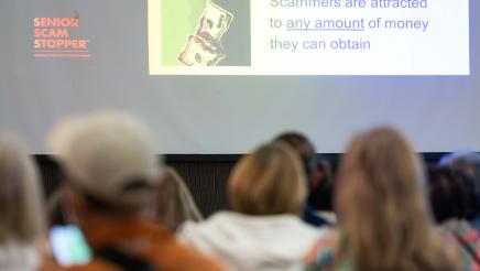 Event presentation with attendees looking on