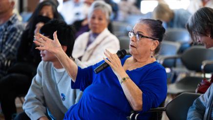 Attendee speaking at the event