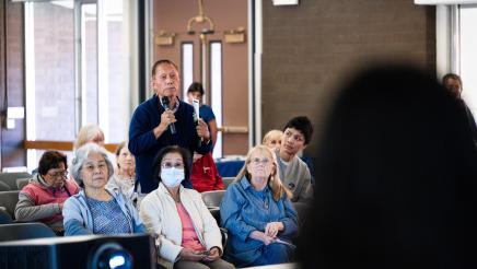 Attendee speaking at the event