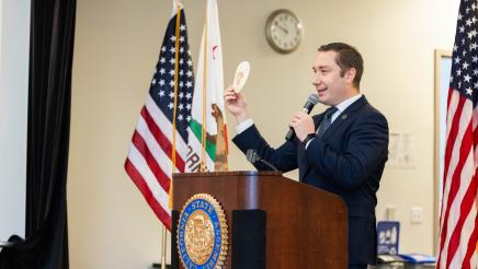 Asm. Ahrens speaking at event Policy and Pancakes
