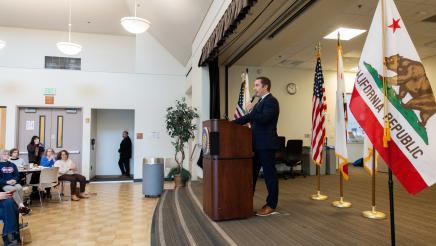 Asm. Ahrens speaking at event Policy and Pancakes