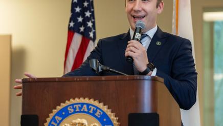 Asm. Ahrens speaking at event Policy and Pancakes