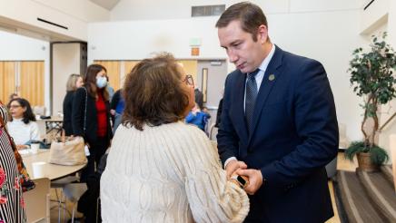 Asm. Ahrens speaking with constituent at the event