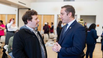 Asm. Ahrens speaking with constituent at the event